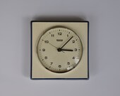 Vintage German ceramic wall clock from MAUTHE. Cream and dark blue. Made in Germany.