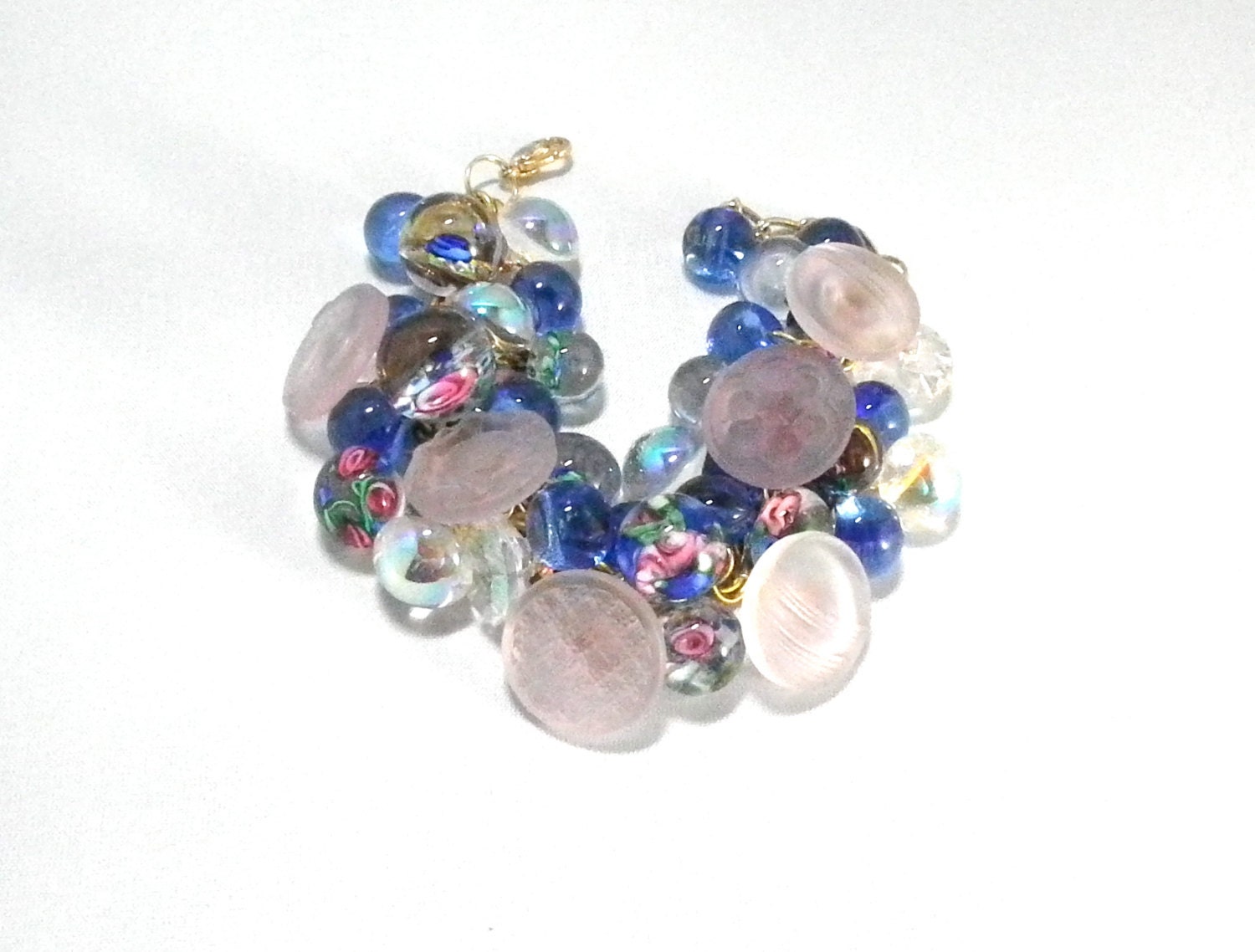 Vintage button bracelet with glass paperweight iridescent buttons in pink and blue