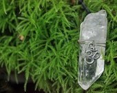 quartz crystal necklace with ohm symbol charm