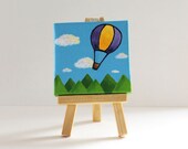 Hot Air Balloon over mountains, Mini Painting, 3x3,  children's illustration, acrylic on canvas with mini easel, blue, green, purple, yellow