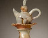 Totem Figure with Teapot and Saucer Companions