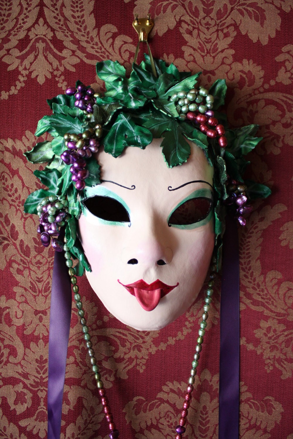 Baccante - Leather Fertility Mask with grape necklace and glass wine flask.