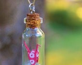 Origami Paper Cranes inside Glass Vials. (Pink Spotty Origami Crane)