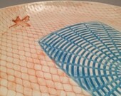 Orange and blue fly swatter plate