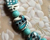Turquoise black and ivory lampwork beads supplies glass