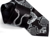 Interlocking dinosaur bones men's tie. "Evolution." Kaleidoscopic skeleton necktie. White screenprint on black microfiber.