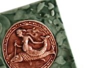 Ancient Mythology - Mermaid riding a Dolphin - handmade ceramic tile glazed in walden green and maroon crackle