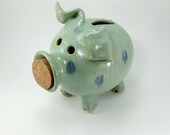 spotted light green piggy bank