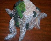 Sculpted tree stump with moss accents