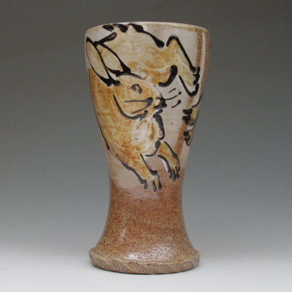 Pilsner with slip trailed rabbits  wood fired salt glazed stoneware