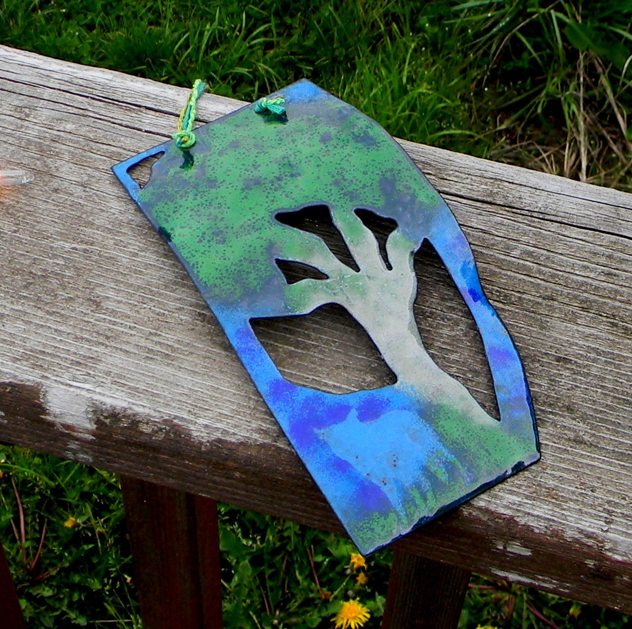 the coyote and the tree - enamel wall hanging