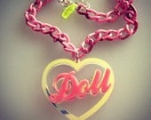 DOLL radiant bubblegum pink word laser cut necklace