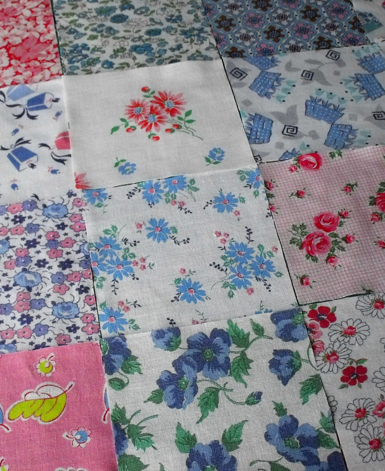 16 vintage feedsack 5-inch squares from the 1940s-1950s, lots of pink and blue florals