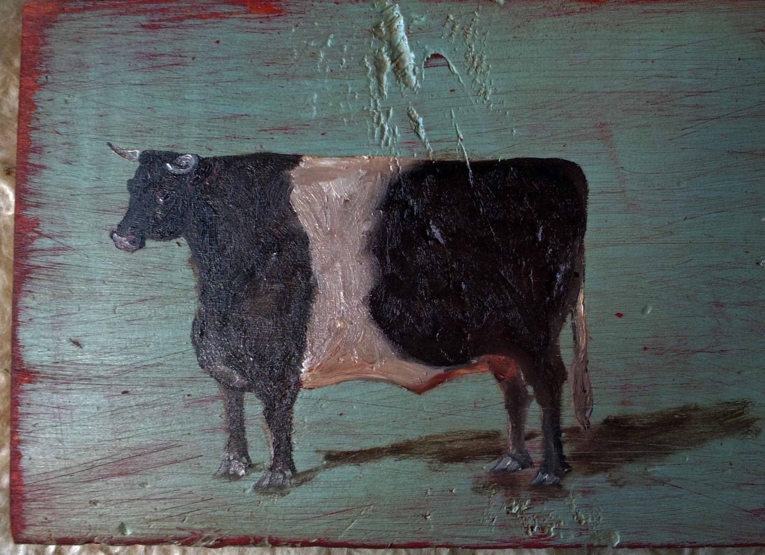 Cow on old wood