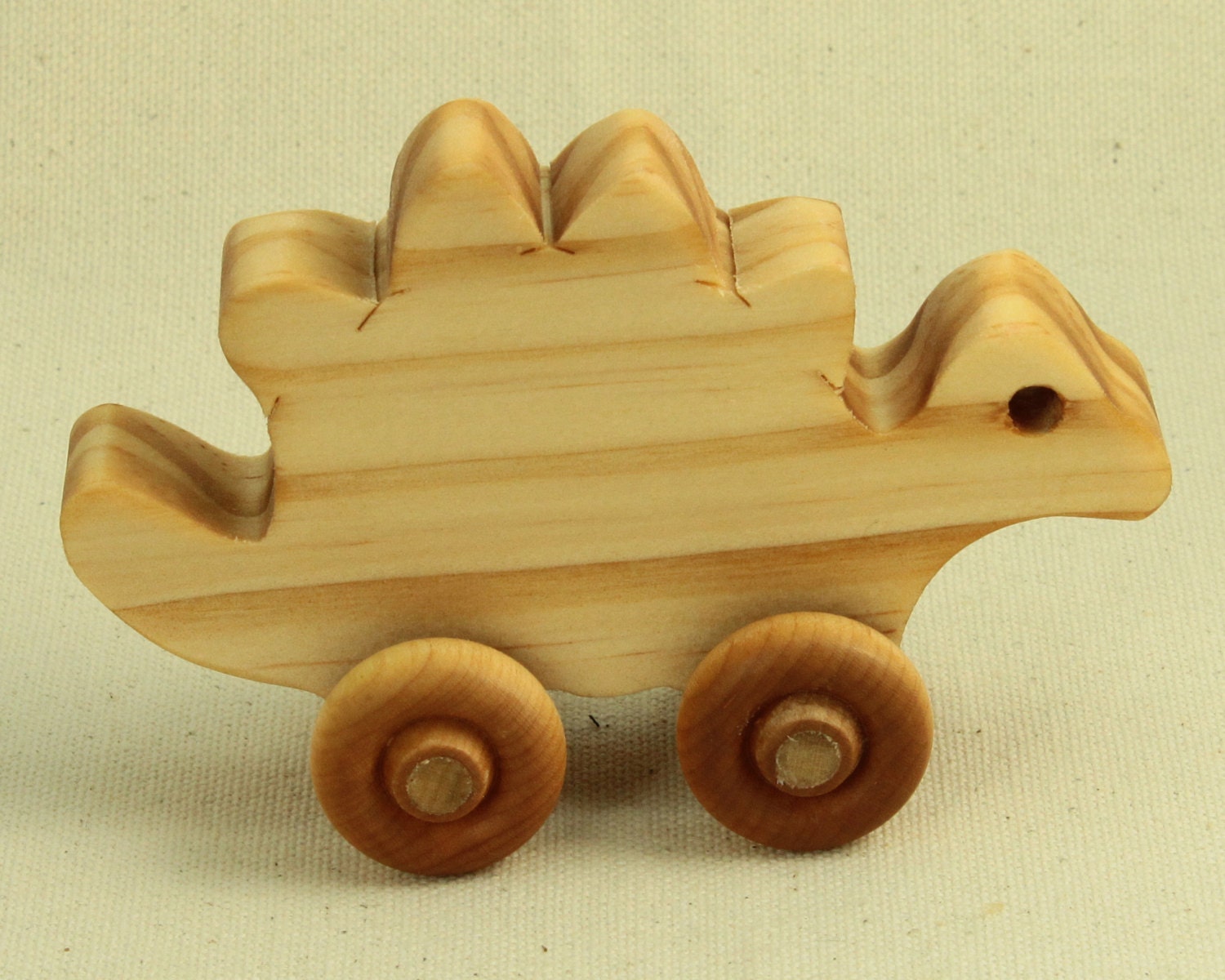 mini stegosaurus wooden dinosaur toy