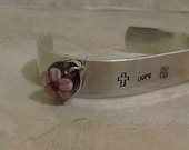 Aluminum Cuff Bracelet with Lampwork Flower Stamped "Faith, Hope, Love"