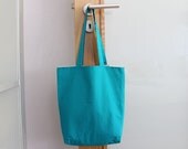 Reversible cotton tote bag in teal and beige polka dots