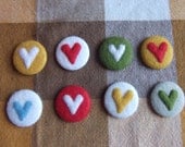 three felt heart badges