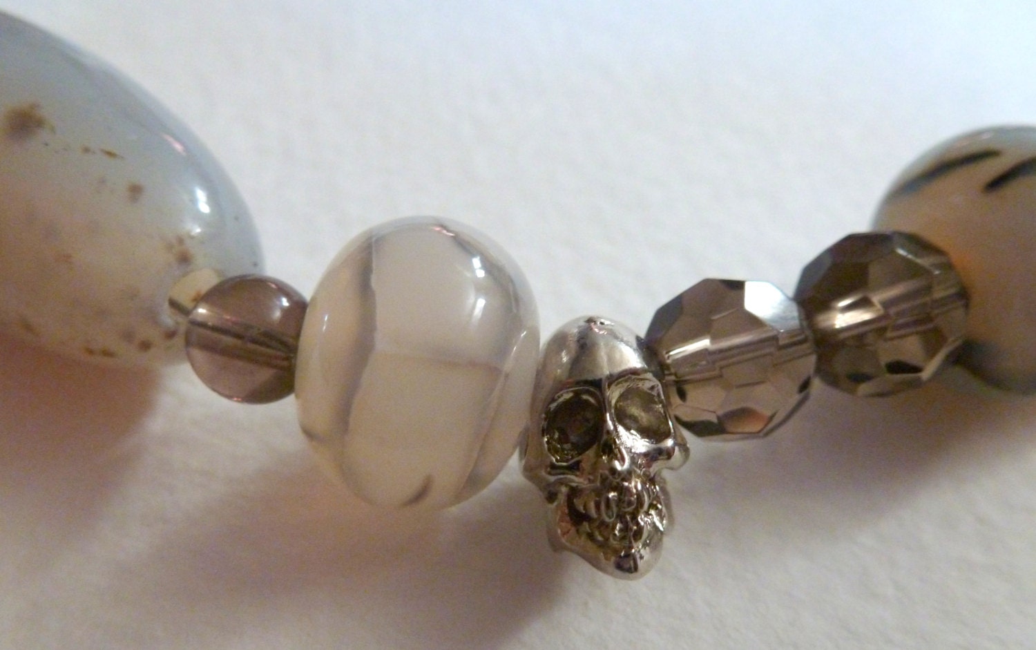 legend  -  smoky quartz, rutilated quartz, black fire agate, and metal skulls