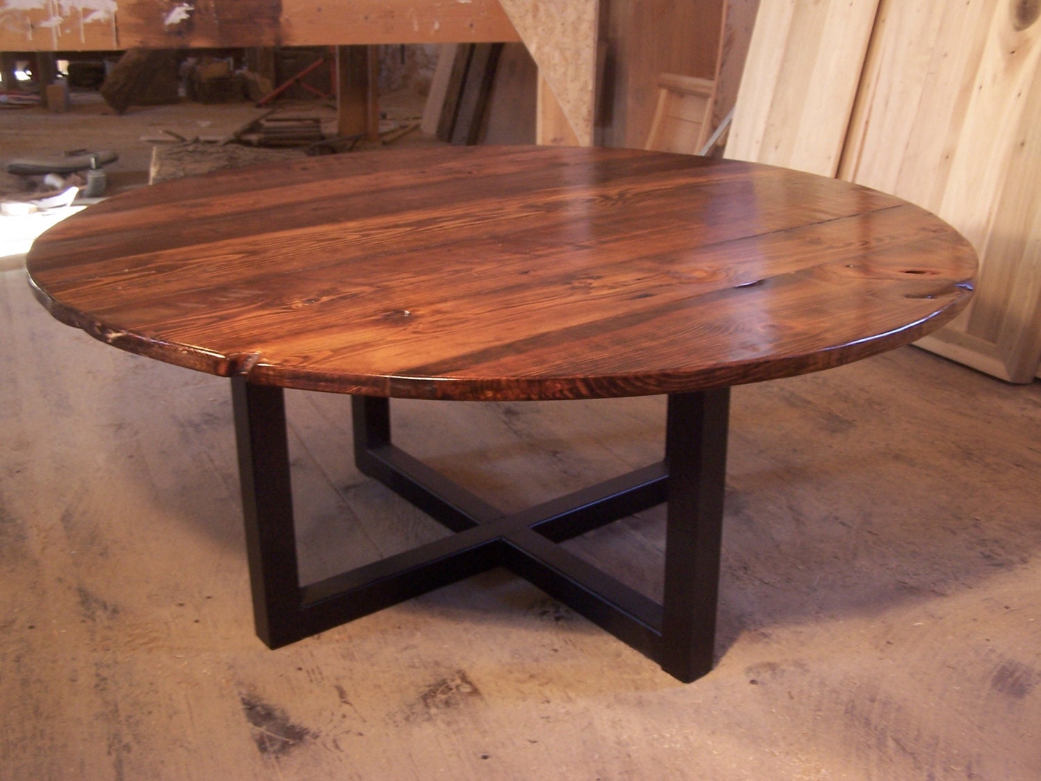 Large round coffee table with industrial metal base