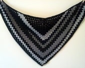 crocheted triangle granny square shawl in black and gray