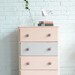 Peach and gray chest with owl knobs named Liesbeth