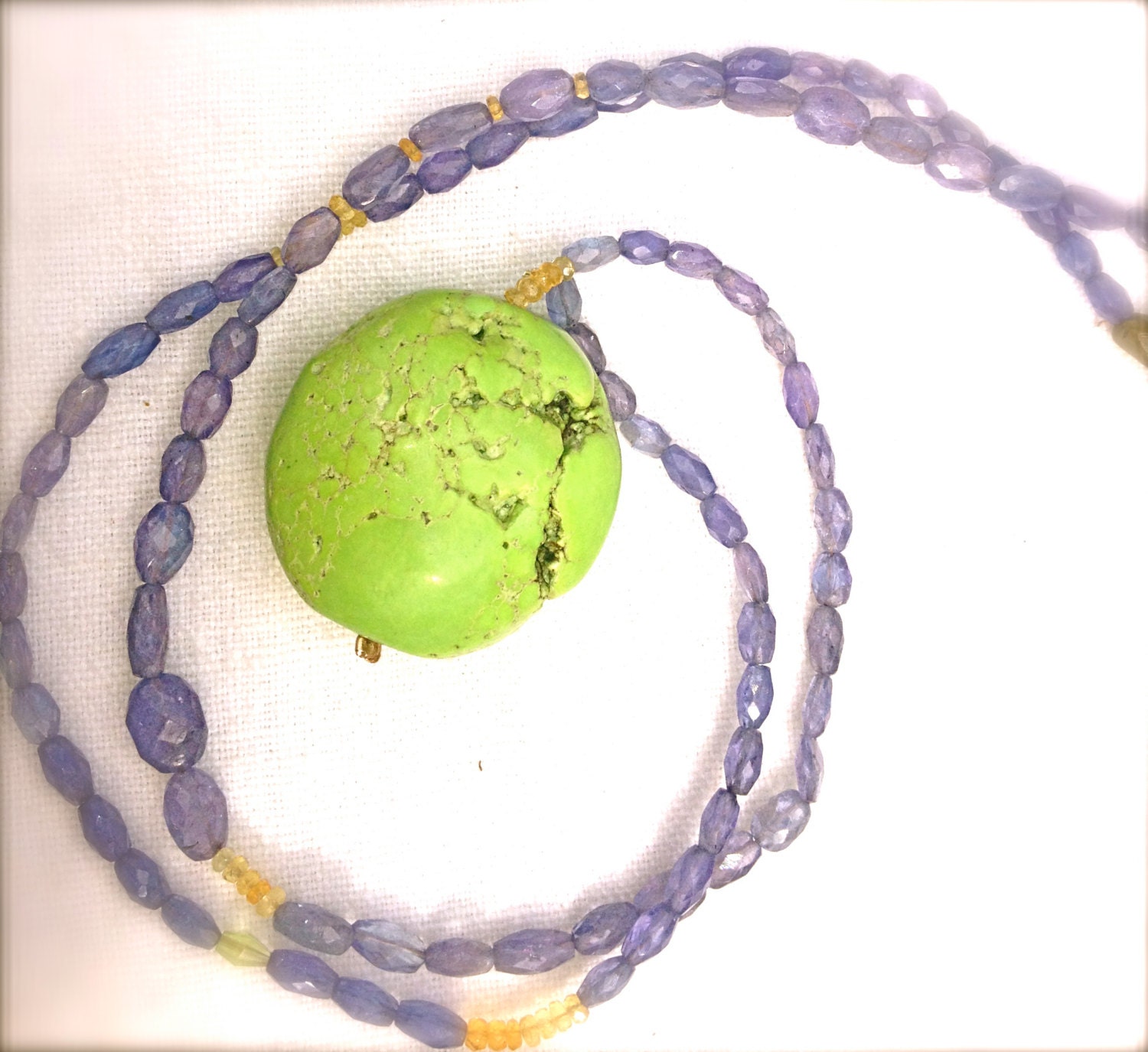 Apple green chalcedony pendant on cut amethist necklace