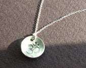 Keep Breathing. Sterling silver hand stamped domed Om necklace.
