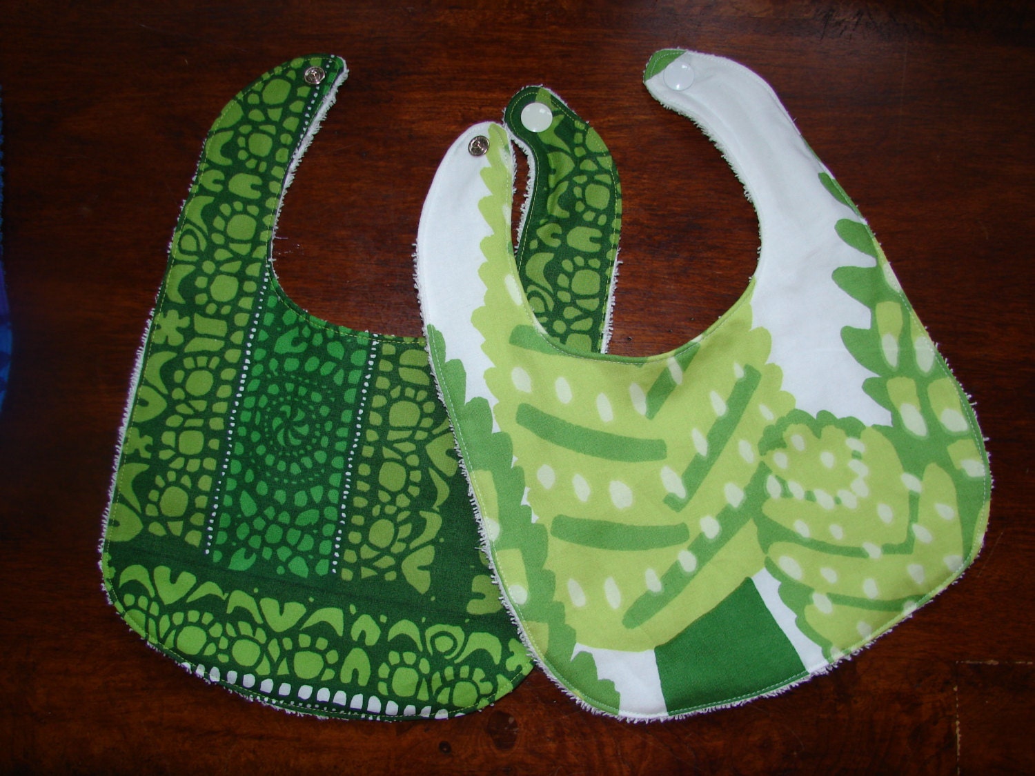 Set of 2 Green White Beige baby bibs, made from Marimekko cotton fabrics, Metsanvaki, Pidot, Finland