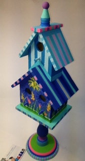 Deluxe Pedestal Double Decker Wood Birdhouse with three bird hole entrance openings painted in stripes and floral designs and ready to ship