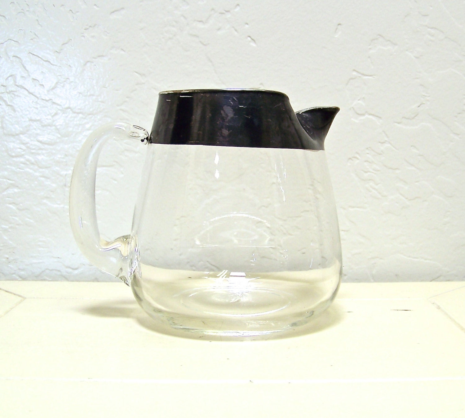 vintage silver rimmed cocktail pitcher