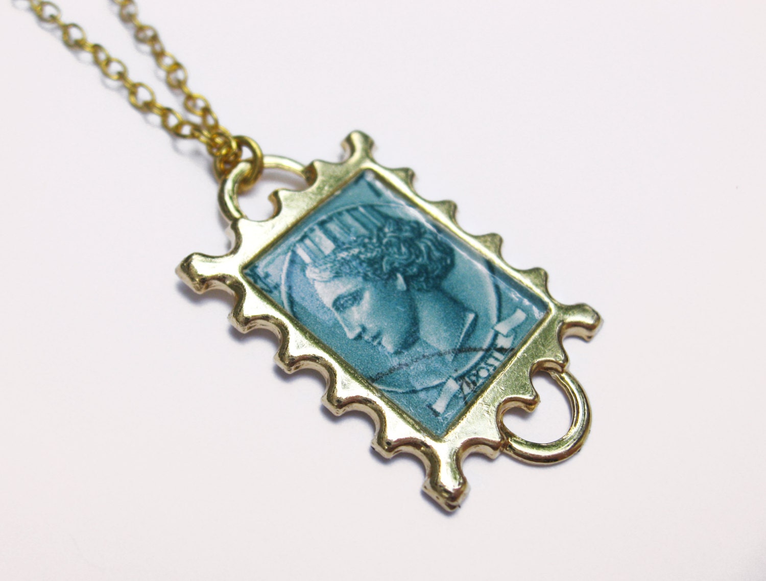 a piece of italia - teal postage stamp necklace.