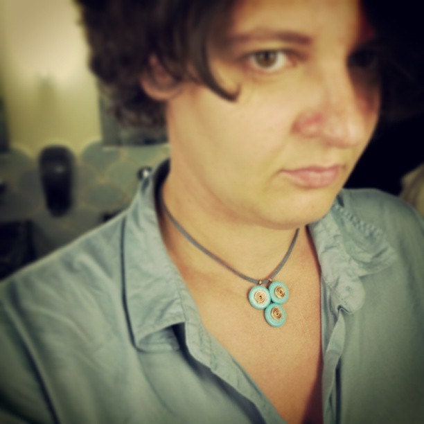Mint blue triangle casual pendant with copper spirals made in Israel.