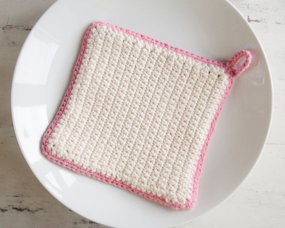 Crochet pot holder, thick hot pad in cream yarn with pink border