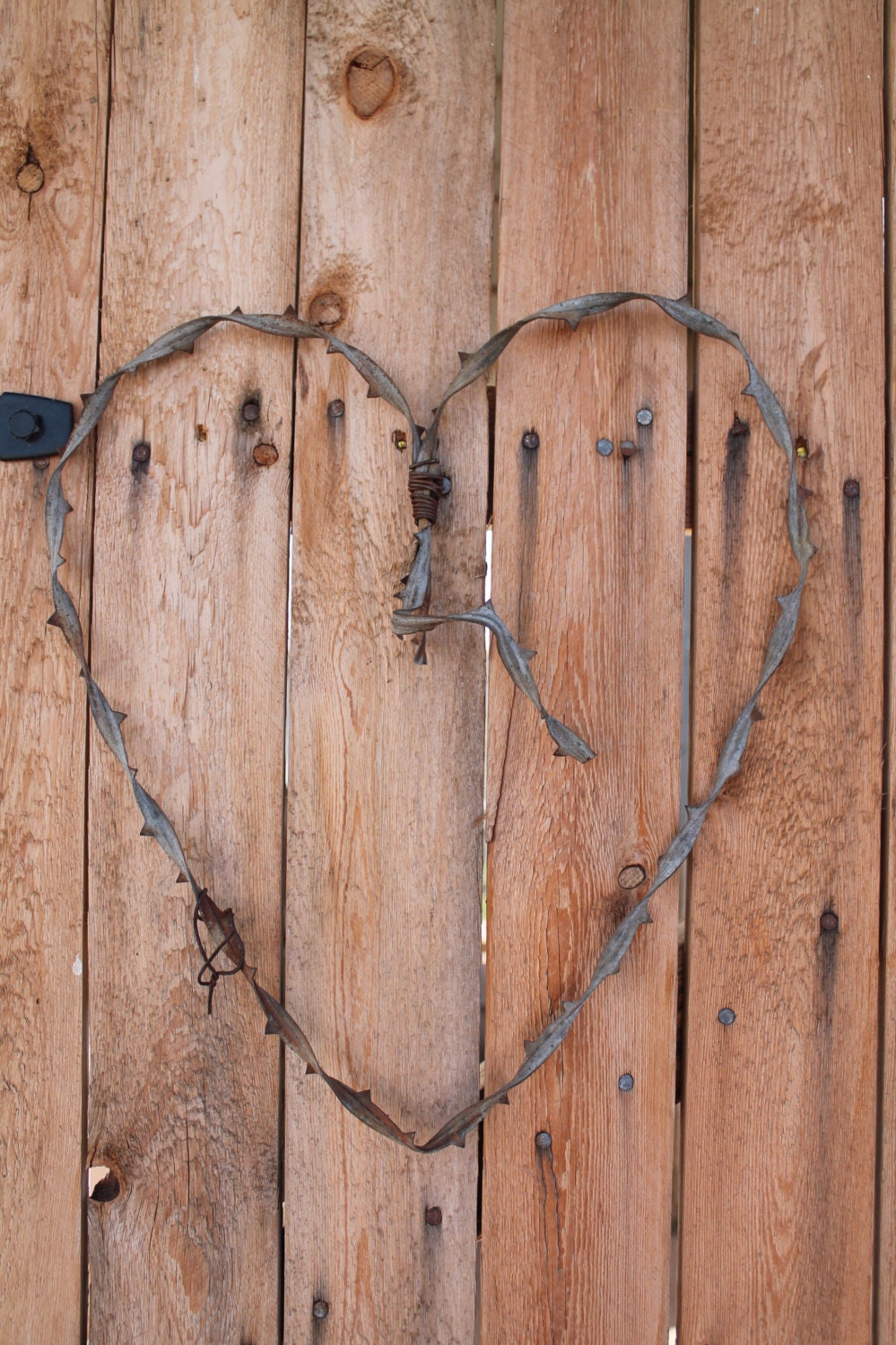 large barbed wire handmade heart wall decor made from old ribbon wire