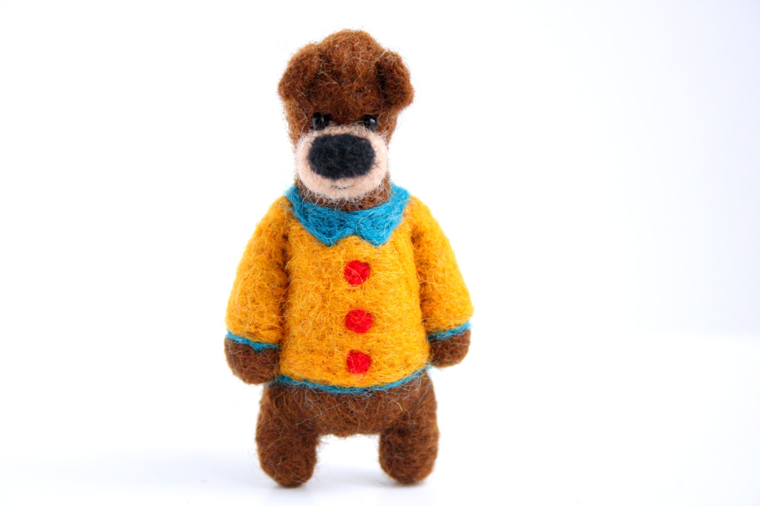 Brown bear with an orange jacket, brooch