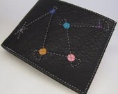 Black and pink leather wallet with geometric detailing