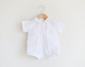 Vintage white baby jumpsuit with a hat.