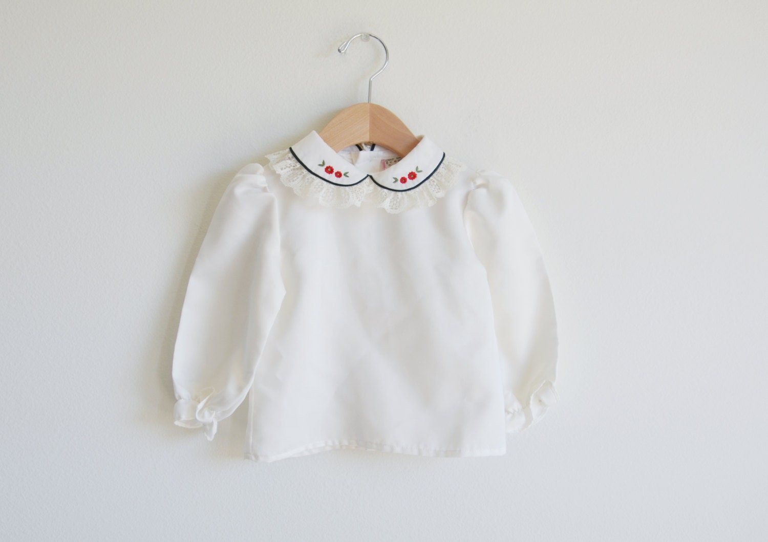 Vintage baby girl's blouse top with lace trim.