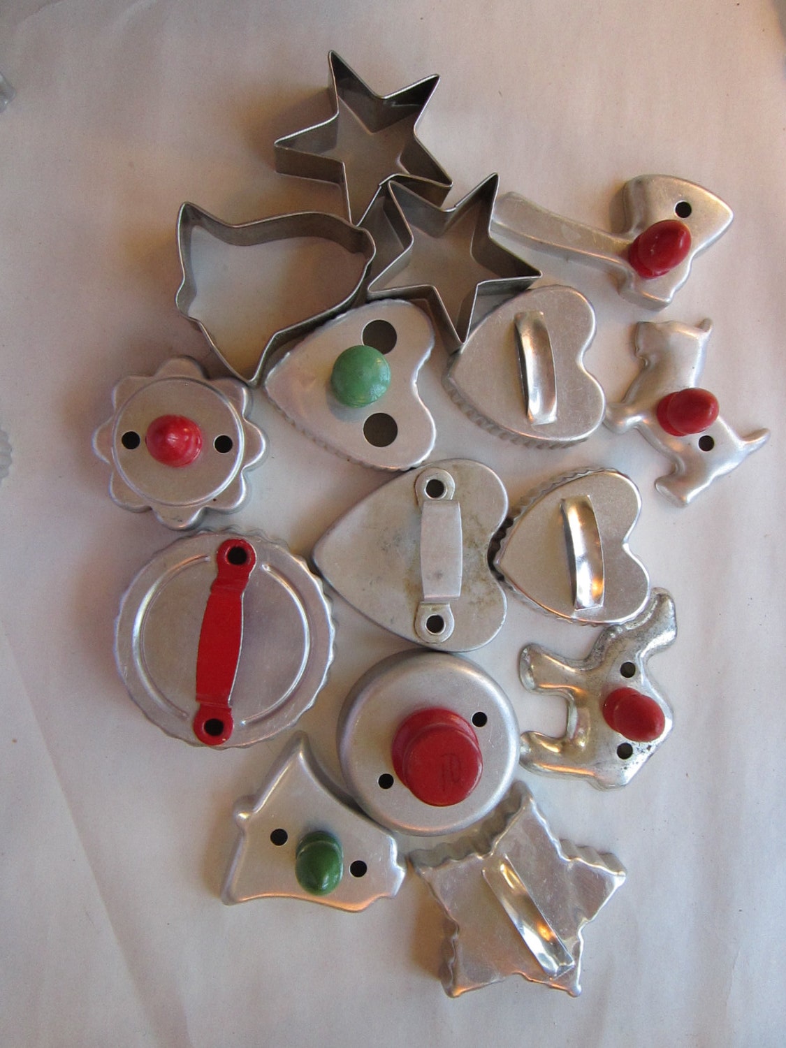 15 cookie cutters - mostly VINTAGE - tomahawk, scotty dog, camel, hearts stars, bells circles, some wood handles