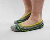 Hand knit grey wool socks for unisex adults with green ornaments