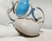 Larimar infinity bracelet, Never ending Paradise - striking deep Caribbean turquoise Larimar oval