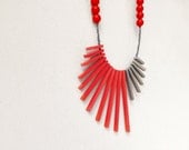 tribal asymmetric minimal necklace with red and grey sticks and beads - contemporary jewelry - pergamondo
