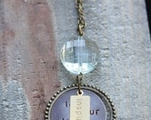 Let your life speak - mixed metal design - hangs from large pale aqua drop, floats in a decorative antique gold ring, with 'inspire' pendant
