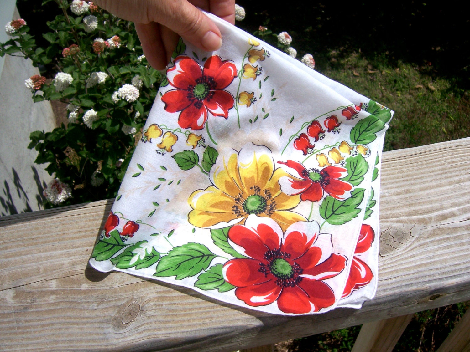 Hanky of white cotton with yellow, red, green and black floral design. Gift idea handkerchief for women, mother of the bride and groom.