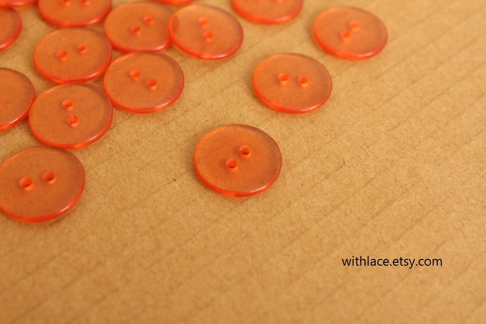 Set of 10 clear burnt orange plastic buttons, 14mm