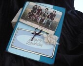 Birthday card with envelope on beach