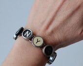 I love NY vintage typewriter key bracelet - with a selection of numbers, letters and symbols