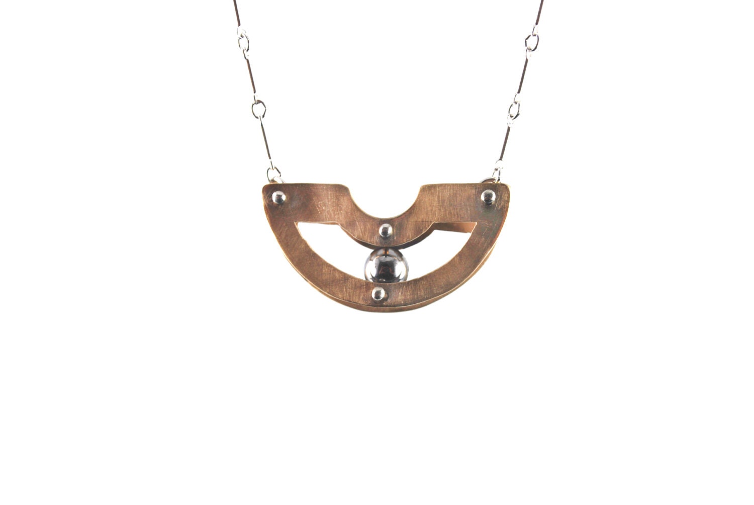 Handmade jewelry. Modern design. Brass and sterling silver with moving ball bearing necklace.