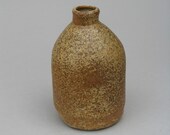 Small stoneware vase with ash